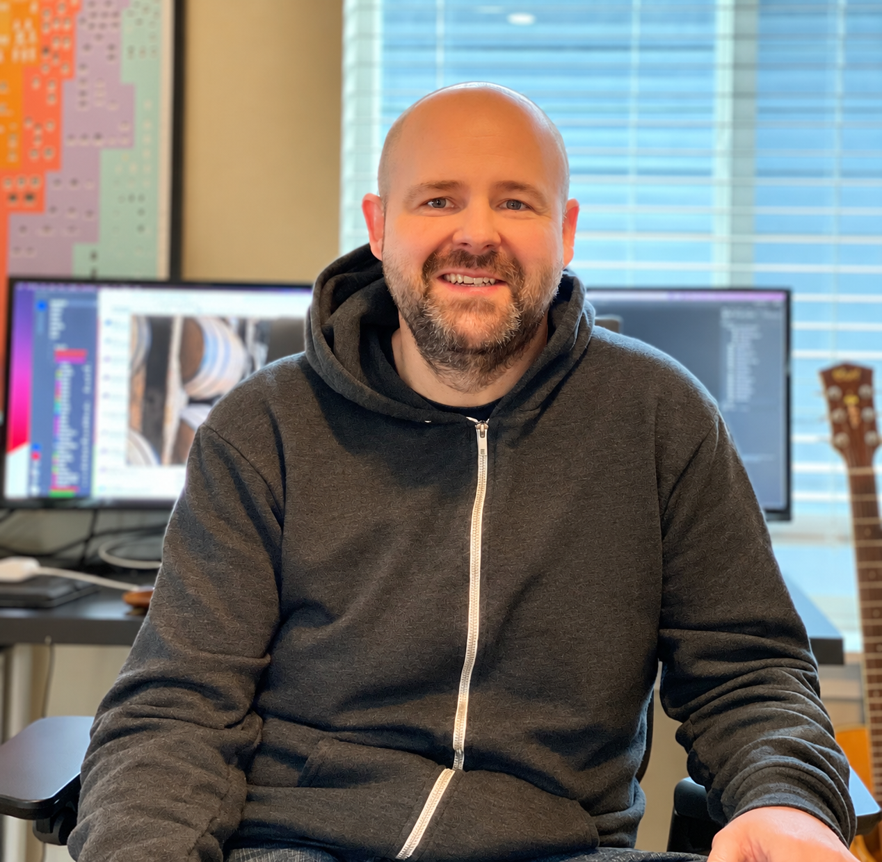 Gregg Richter seated in his creative workspace